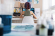 © Milles Studio/Stocksy - Unrecognizable female illustrator drawing near window