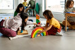 © Valentina Barreto/Stocksy - Kids playing with colorful toys on a playdate