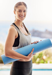 Sticker - On my way to yoga class. Portrait of an attractive young woman carrying her yoga mat to class.