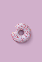 One Bitten Glazed Donut With Sprinkles