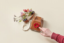 Male Hand Near Vintage Telephone With Flowers