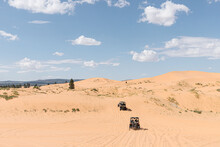 All-terrain Vehicles Driving In Sand Dunes