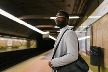 Stylish Black Man Waiting For Train In Metro