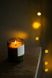 © Duet Postscriptum/Stocksy - Burning natural candle with a wooden wick