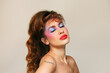 © Ángela Rober/Stocksy - Retro woman with eyes closed with eighties look