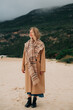 © Olga Moreira/Stocksy - Woman on a beach during winter