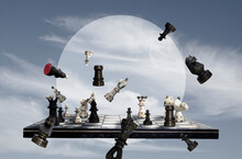 Chess Pieces And Chess Board On Sky Background