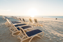 Empty Chairs On A Beach