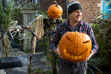 Man Holding Halloween Jack-O-Lantern