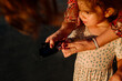 © Erin Brant/Stocksy - Mother squeezes blood for glucose diabetes test