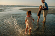 © Erin Brant/Stocksy - Happy girl with limb difference at beach.