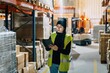 © Sergio Marcos/Stocksy - Female worker preparing order for delivery in warehouse