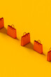 © Giada Canu/Stocksy - Orange shopping bag with copy space. 3d render