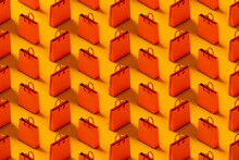 Pattern Of Orange Shopping Bag On A Yellow Background