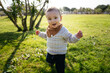 © Manu Padilla/Stocksy - Cute child walking on lawn