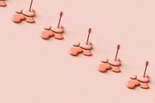 A Row Of Pink Hearts With Cupid's Arrow.