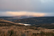 © Liam Grant/Stocksy - Sunset breaking through over Glen Franka Reservoir in Leadhills
