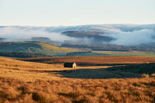 Fog Covered Hills And Distant Barn In Lancashire