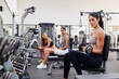 © Ivan Gener/Stocksy - Girls watching a woman exercising at the gym