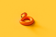 Inflatable Flamingo On Yellow Background. 3d Render