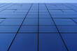 © Daniel Gonzalez/Stocksy - Facade of modern glass building