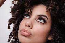 Model With Curly Hair And Sparkly Eyeshadows