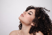 Model With Curly Hair And Sparkly Eyeshadows