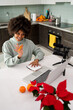 © Mauro Grigollo/Stocksy - Black woman at work on a webinar