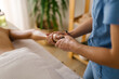 © STUDIO TAURUS/Stocksy - Massage therapist at work with client
