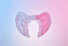 White Angel Wings Of Feathers Over Gradient Background