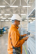 © STUDIO TAURUS/Stocksy - Senior Man Using A Tablet In A Factory For A  Production Control