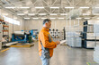 © STUDIO TAURUS/Stocksy - Senior Man Using A Tablet In A Factory For A  Production Control