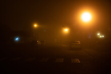 Incandescent Street Lights In The Fog