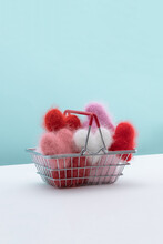 Colorful Hearts Made From Yarn Inside Shopping Basket