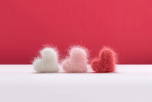 Three Fluffy Hearts Made From Colorful Yarn