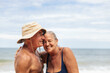 © Pedro Merino/Stocksy - Happy elderly couple having a good time on the beach