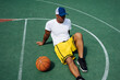 © Vertikala/Stocksy - Anonymous fit black guy on a basketball court