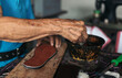 © Pedro Merino/Stocksy - Anonymous senior shoemaker