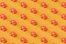 Pattern Of Pink Toy Car On A Yellow Background