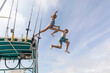© Raymond Forbes LLC/Stocksy - Best Friends Jumping off boat into water while swimming