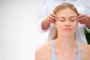 Massaging the stress away. Cropped shot of a young woman enjyoing a massage at the day spa.