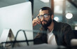 © Nicholas Felix/peopleimages.com - The later it gets the deeper he goes. Shot of a young businessman using a computer during a late night in a modern office.