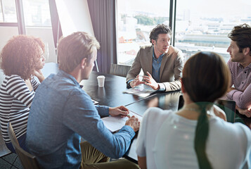 Poster - The ideas are flowing.... Shot of a group of coworkers having a brainstorming session in an office boardroom.