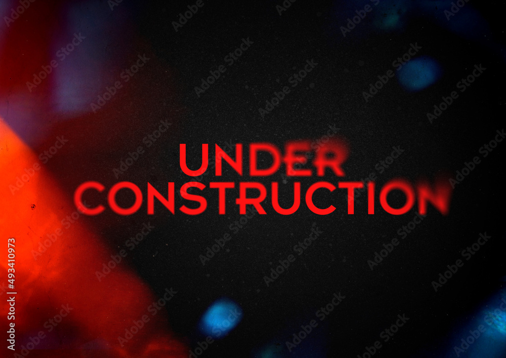Under construction title, grunge style with grain and partial blur ...