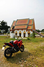 Ancient Architecture Antique Building Ubosot Of Wat Khien Or Khian Buddhist Temple For Thai People Riding Motorcycle Sport Travel Visit Respect Praying Buddha And Holy Worship In Nonthaburi, Thailand
