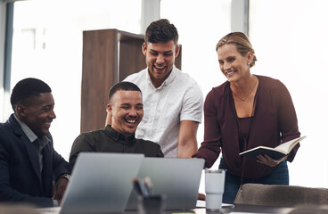 Aufkleber - Seeing their plan all come together. Shot of a group of businesspeople working together on a laptop in an office.