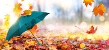Autumn Background With Green Umbrella And Fallen Maple Leaves