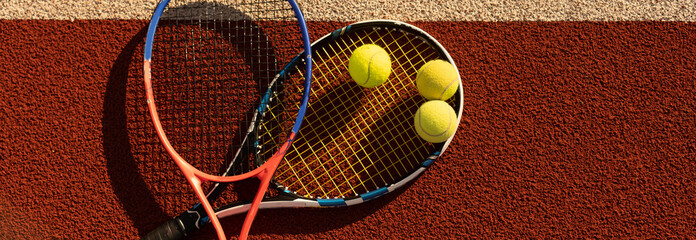 Tennis Ball with Racket on the racket in tennis court