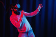 © endrews21 - A brutal bearded man in virtual reality glasses plays a computer game. The guy in the metaverse explores the location and the virtual world.