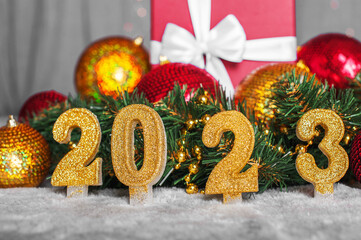 Happy new year 2023 background. New year holidays and christmas card invitation with bright lights, gifts.